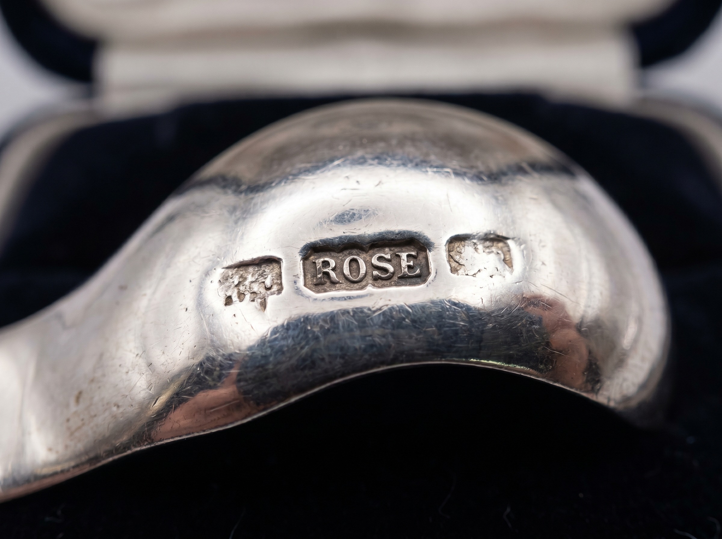 Extreme macro of Sheffield Assay Office rose hallmark struck on sterling silver