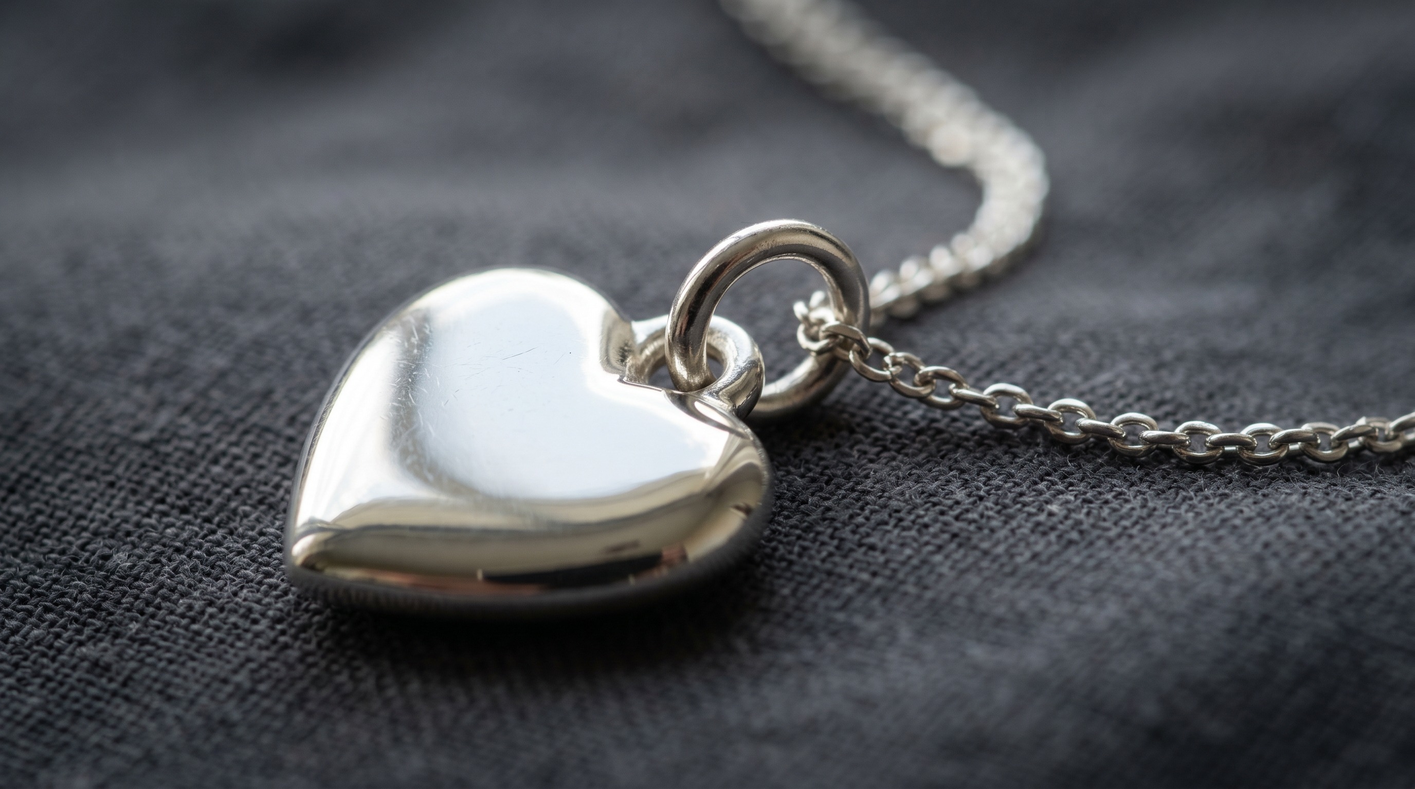Close-up of a silver Return to Tiffany heart tag charm