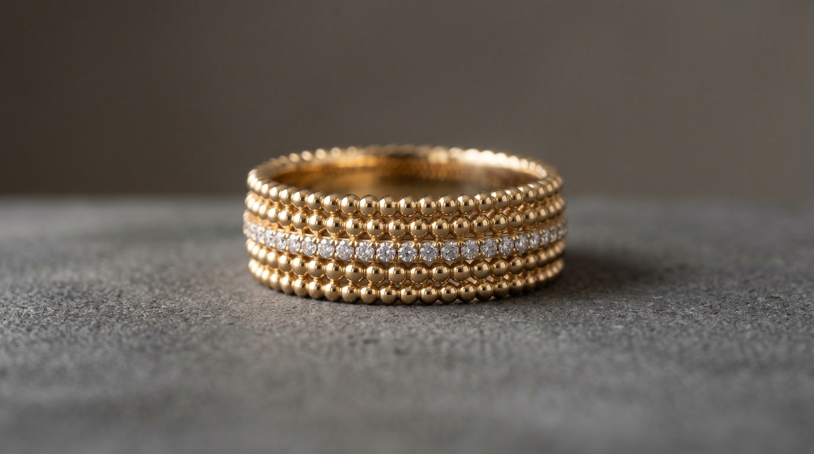 Van Cleef Perlée-style gold beaded band ring with diamonds