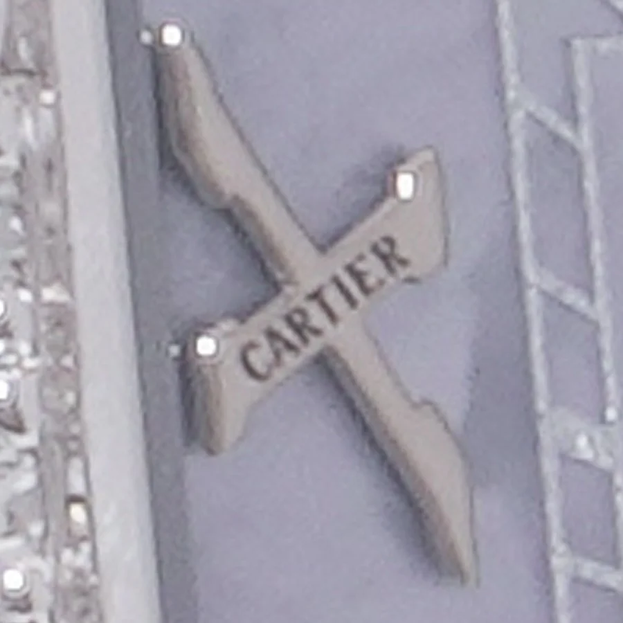 Close-up of the hidden CARTIER signature in the X numeral of our Cartier Panthère