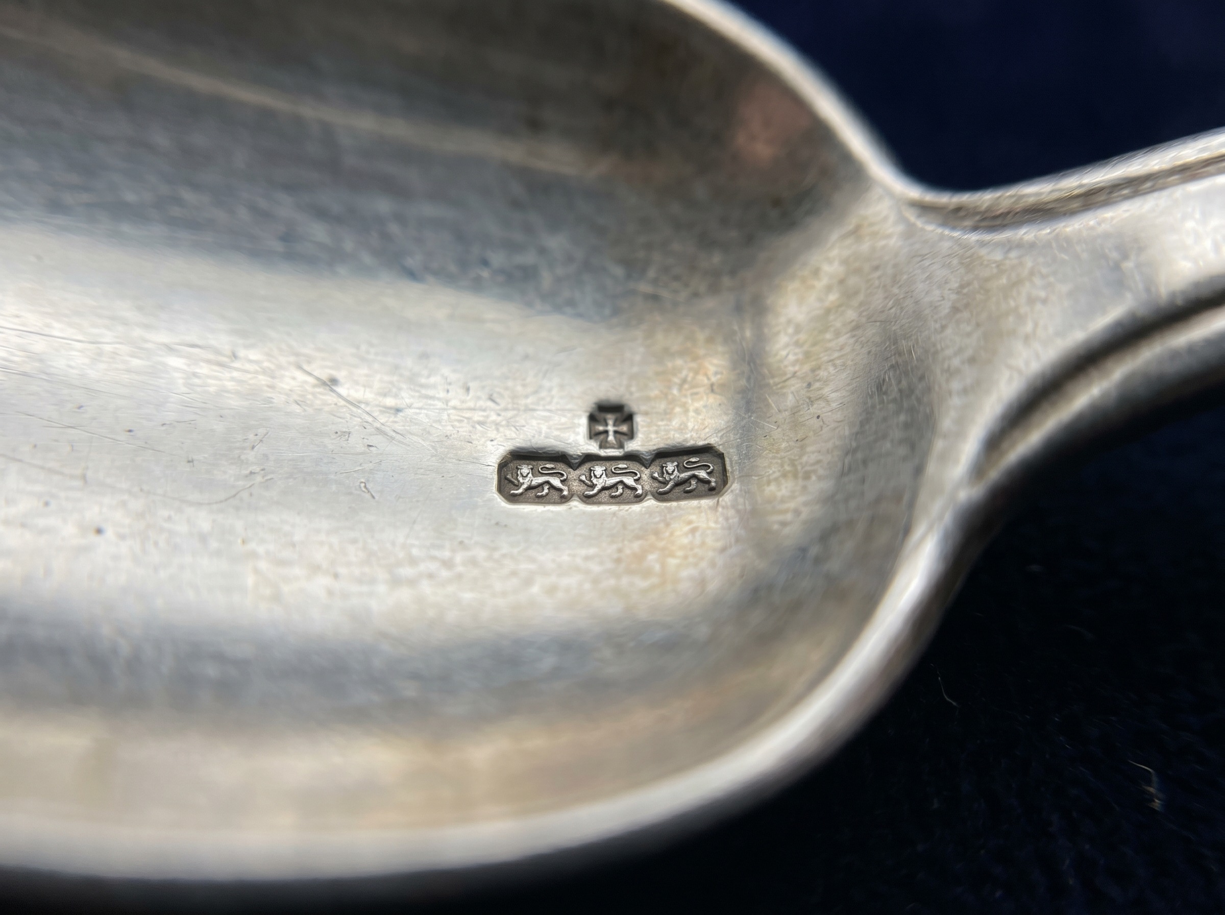 Extreme macro of York Assay Office five lions passant hallmark struck on antique sterling silver